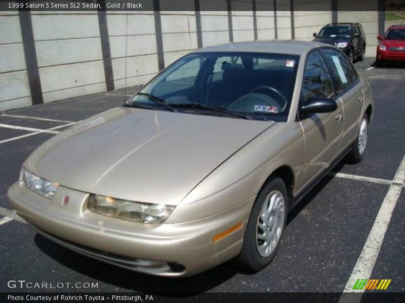Gold / Black 1999 Saturn S Series SL2 Sedan