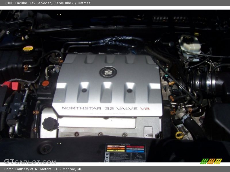 Sable Black / Oatmeal 2000 Cadillac DeVille Sedan