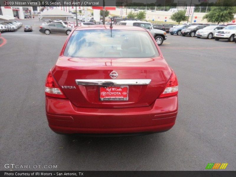 Red Alert / Charcoal 2009 Nissan Versa 1.8 SL Sedan