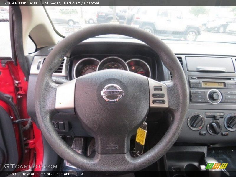 Red Alert / Charcoal 2009 Nissan Versa 1.8 SL Sedan