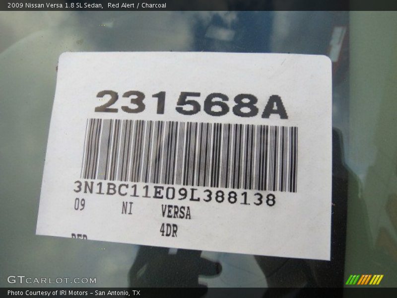 Red Alert / Charcoal 2009 Nissan Versa 1.8 SL Sedan