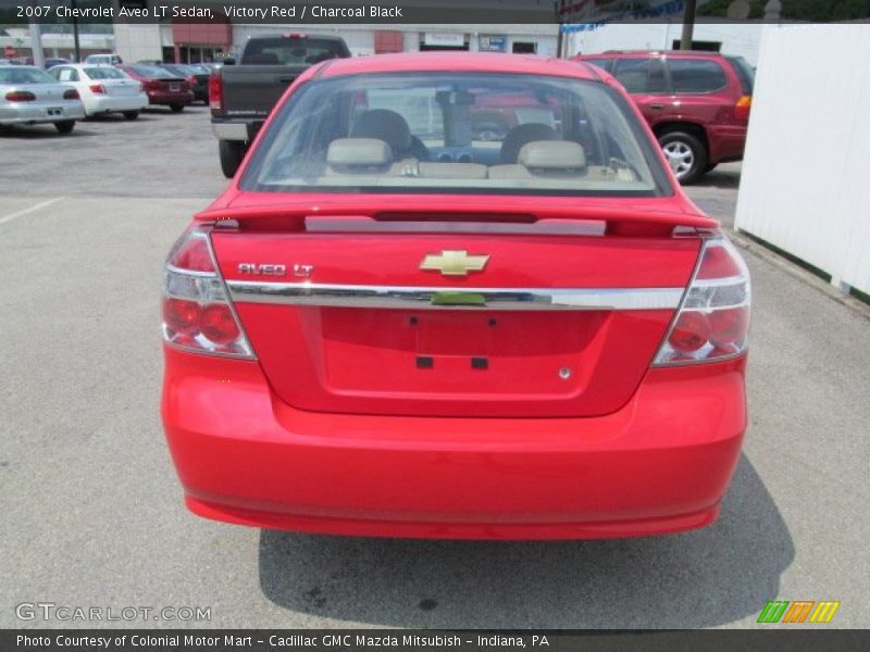Victory Red / Charcoal Black 2007 Chevrolet Aveo LT Sedan