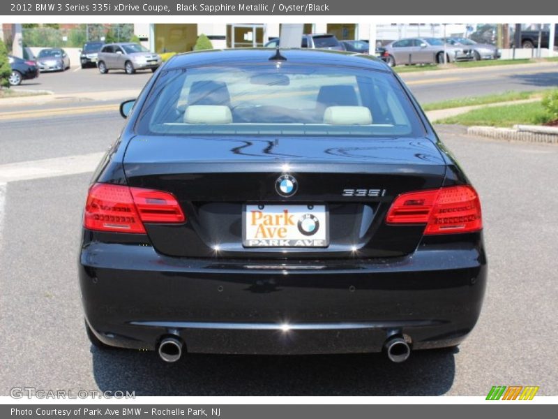 Black Sapphire Metallic / Oyster/Black 2012 BMW 3 Series 335i xDrive Coupe