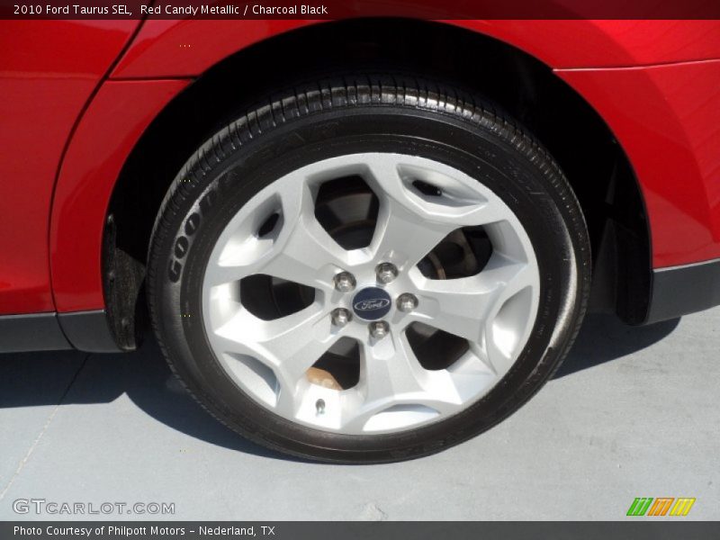 Red Candy Metallic / Charcoal Black 2010 Ford Taurus SEL