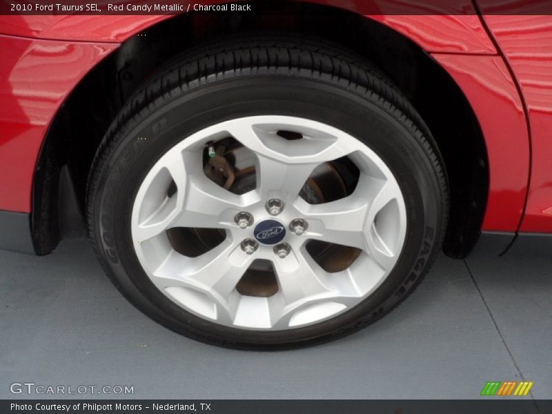Red Candy Metallic / Charcoal Black 2010 Ford Taurus SEL