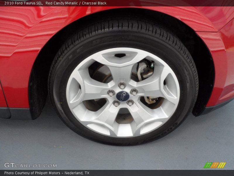 Red Candy Metallic / Charcoal Black 2010 Ford Taurus SEL