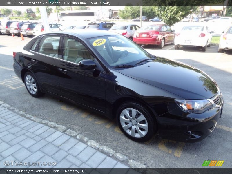 Obsidian Black Pearl / Ivory 2009 Subaru Impreza 2.5i Sedan