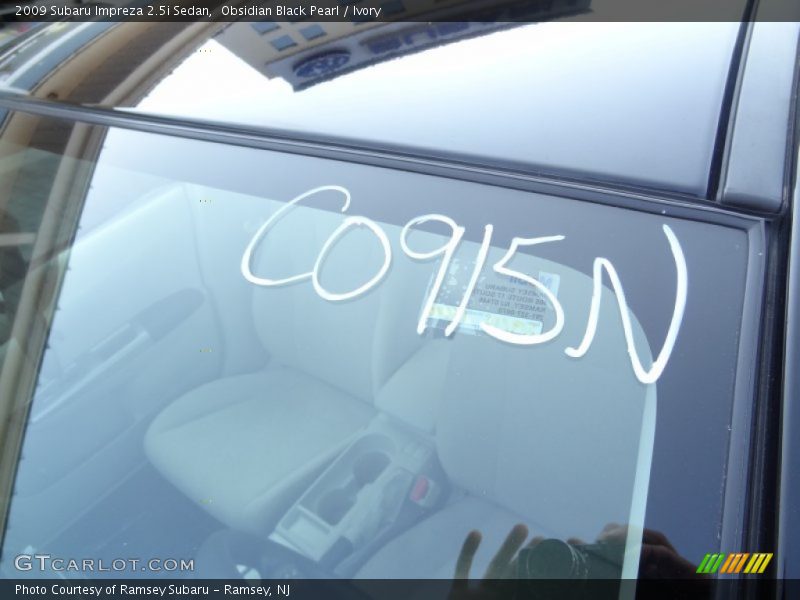 Obsidian Black Pearl / Ivory 2009 Subaru Impreza 2.5i Sedan