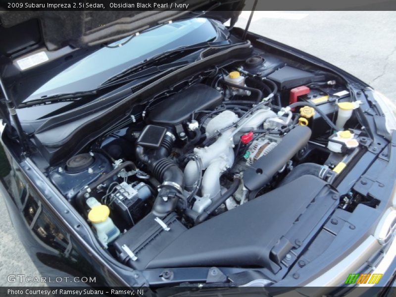 Obsidian Black Pearl / Ivory 2009 Subaru Impreza 2.5i Sedan