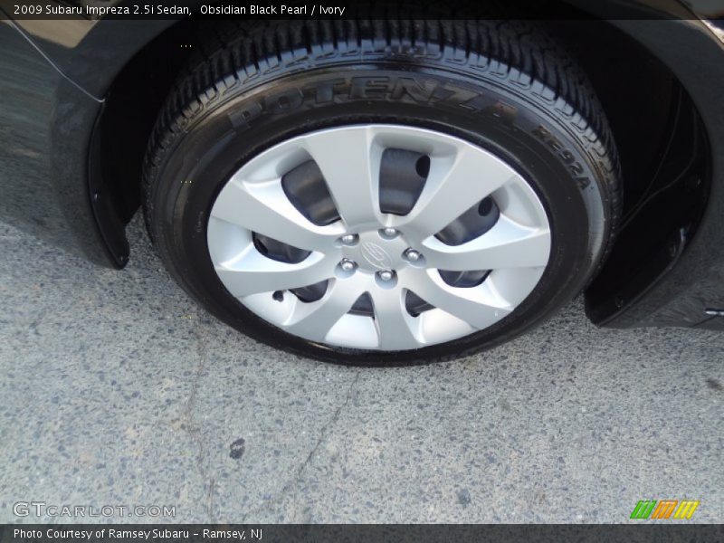 Obsidian Black Pearl / Ivory 2009 Subaru Impreza 2.5i Sedan