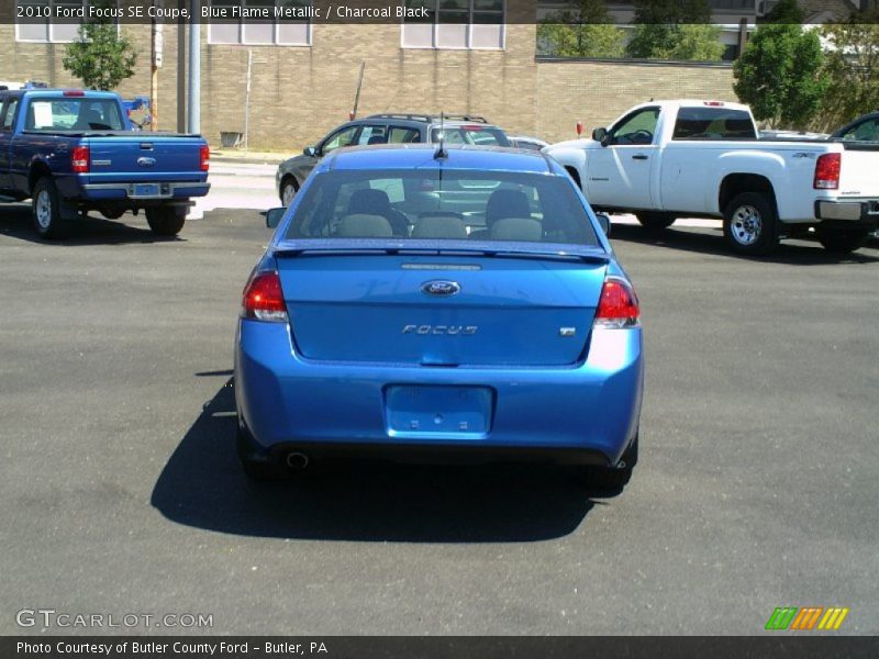 Blue Flame Metallic / Charcoal Black 2010 Ford Focus SE Coupe