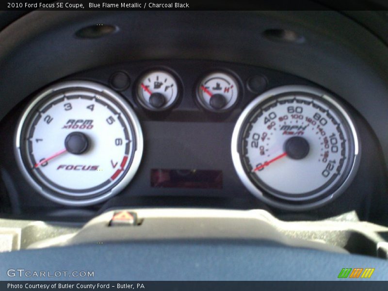 Blue Flame Metallic / Charcoal Black 2010 Ford Focus SE Coupe