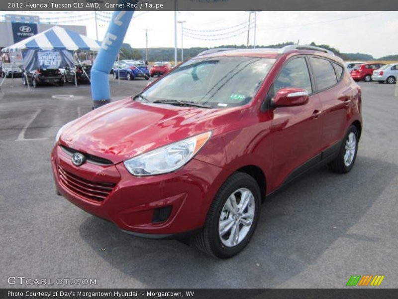 Garnet Red / Taupe 2012 Hyundai Tucson GLS AWD