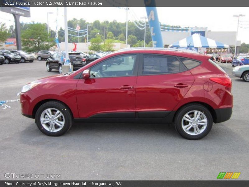 Garnet Red / Taupe 2012 Hyundai Tucson GLS AWD