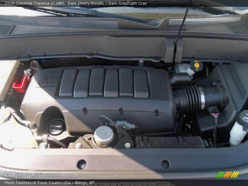 Dark Cherry Metallic / Dark Gray/Light Gray 2010 Chevrolet Traverse LS AWD