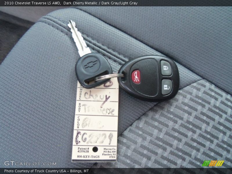 Dark Cherry Metallic / Dark Gray/Light Gray 2010 Chevrolet Traverse LS AWD