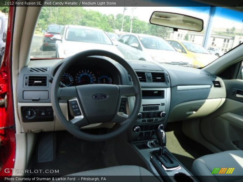 Red Candy Metallic / Medium Light Stone 2012 Ford Fusion SE