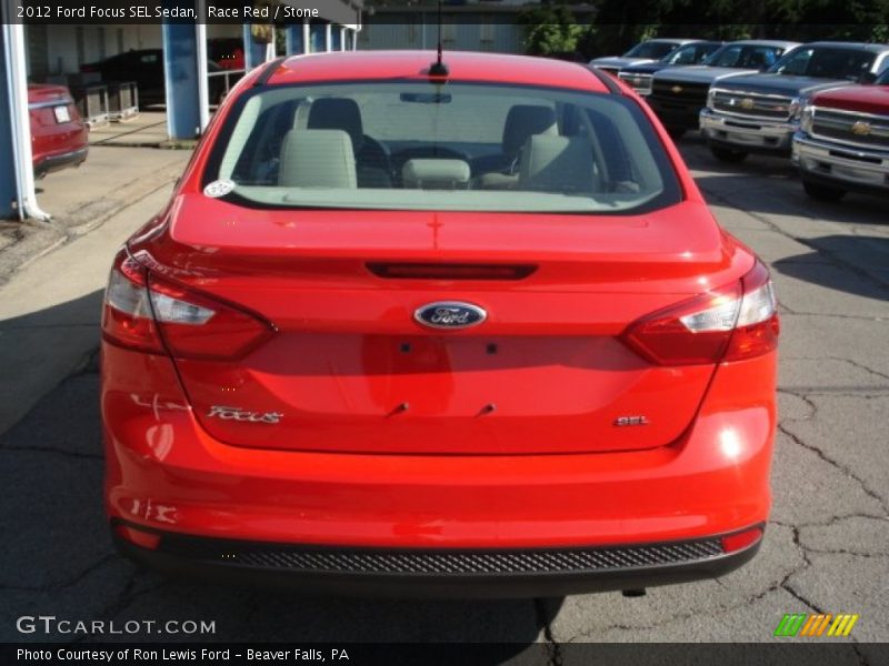 Race Red / Stone 2012 Ford Focus SEL Sedan