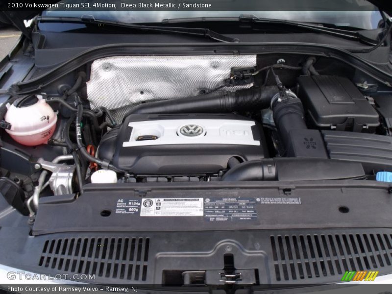 Deep Black Metallic / Sandstone 2010 Volkswagen Tiguan SEL 4Motion