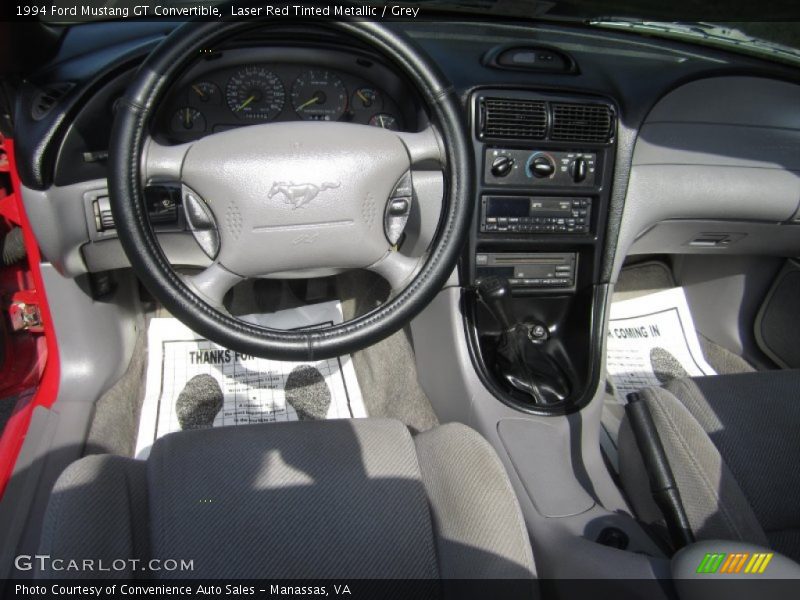 Laser Red Tinted Metallic / Grey 1994 Ford Mustang GT Convertible