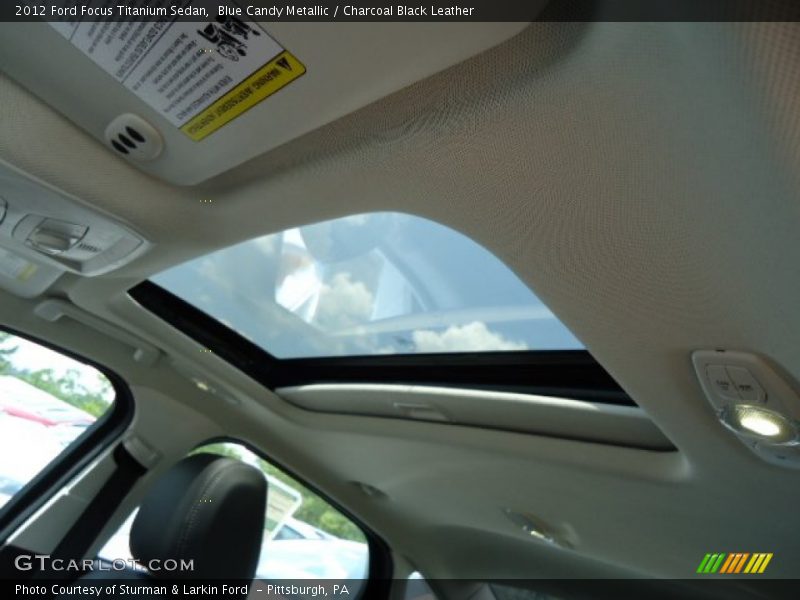 Blue Candy Metallic / Charcoal Black Leather 2012 Ford Focus Titanium Sedan
