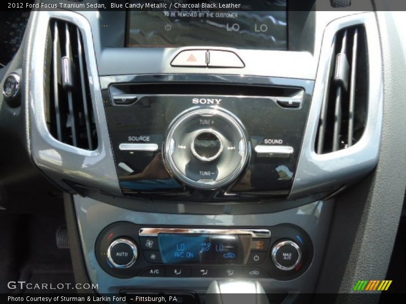 Blue Candy Metallic / Charcoal Black Leather 2012 Ford Focus Titanium Sedan