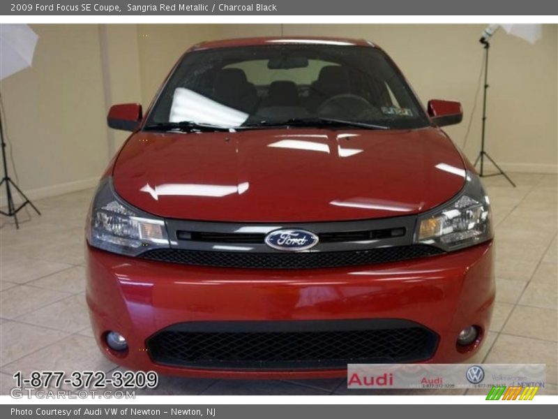 Sangria Red Metallic / Charcoal Black 2009 Ford Focus SE Coupe