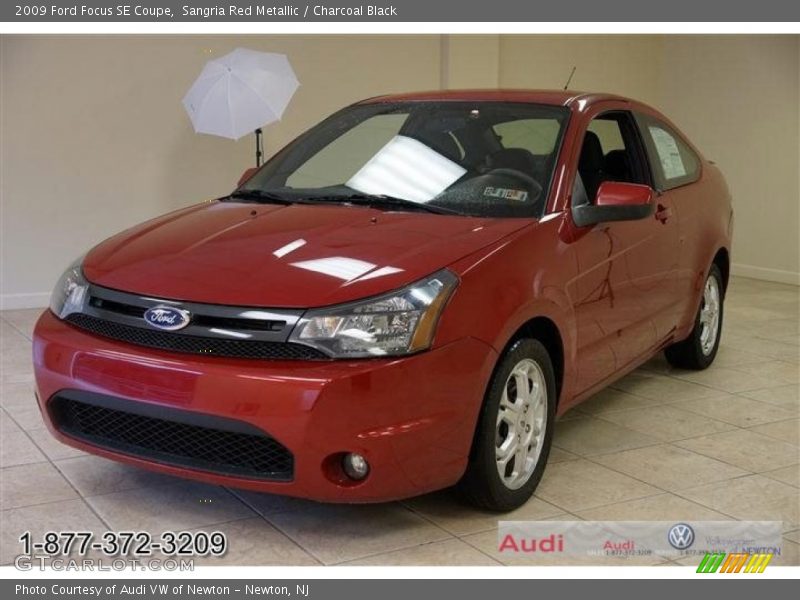 Sangria Red Metallic / Charcoal Black 2009 Ford Focus SE Coupe