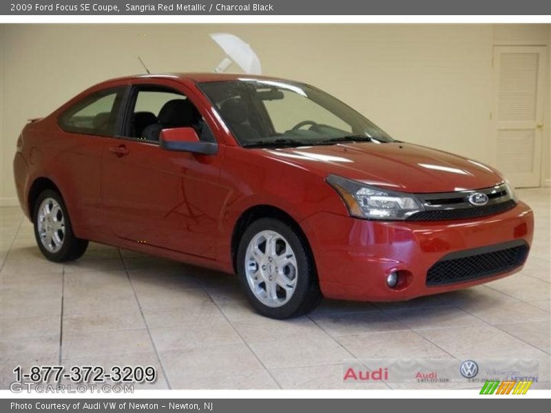 Sangria Red Metallic / Charcoal Black 2009 Ford Focus SE Coupe