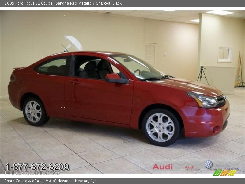 Sangria Red Metallic / Charcoal Black 2009 Ford Focus SE Coupe