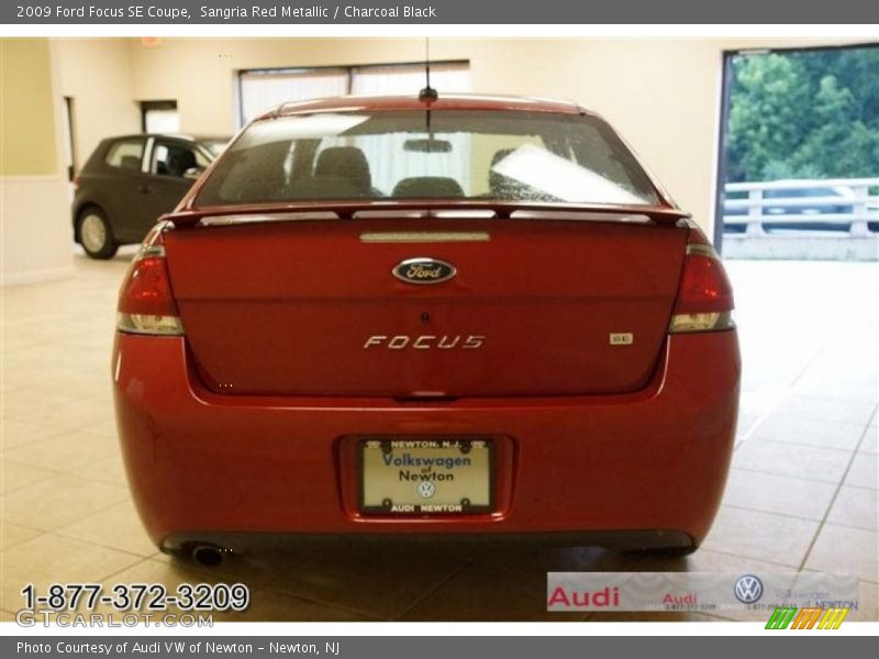 Sangria Red Metallic / Charcoal Black 2009 Ford Focus SE Coupe