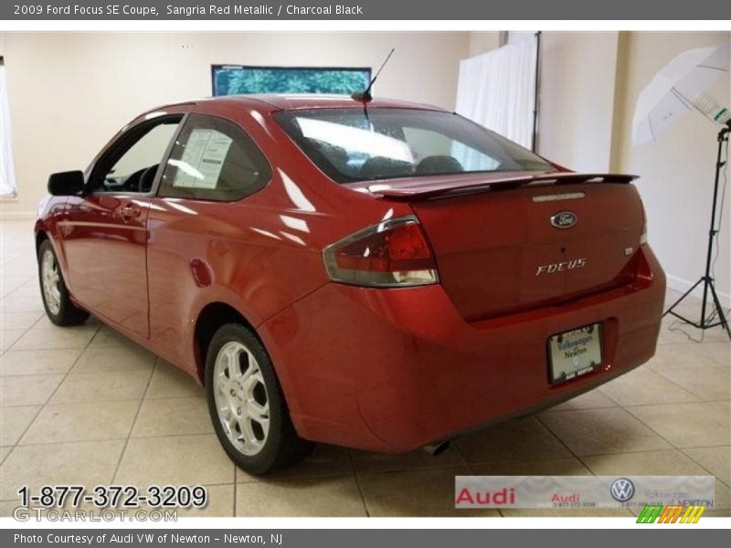 Sangria Red Metallic / Charcoal Black 2009 Ford Focus SE Coupe
