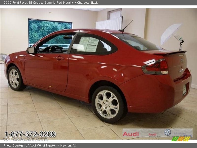 Sangria Red Metallic / Charcoal Black 2009 Ford Focus SE Coupe