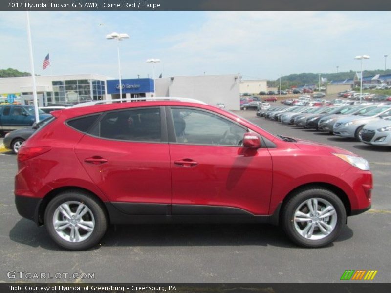 Garnet Red / Taupe 2012 Hyundai Tucson GLS AWD