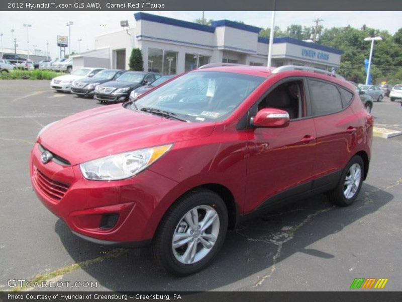 Garnet Red / Taupe 2012 Hyundai Tucson GLS AWD