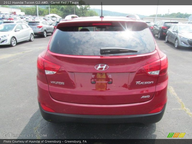 Garnet Red / Taupe 2012 Hyundai Tucson GLS AWD