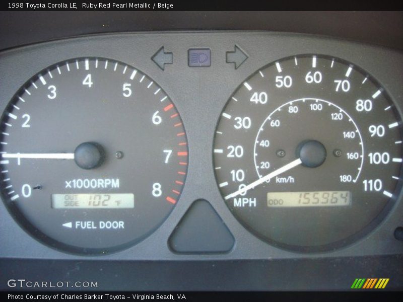 Ruby Red Pearl Metallic / Beige 1998 Toyota Corolla LE