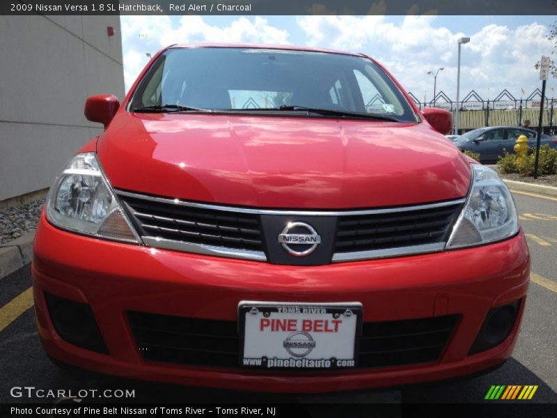 Red Alert / Charcoal 2009 Nissan Versa 1.8 SL Hatchback