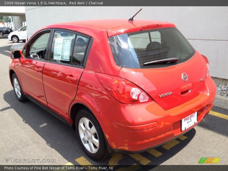 Red Alert / Charcoal 2009 Nissan Versa 1.8 SL Hatchback