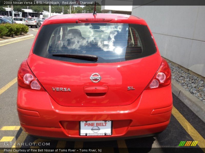 Red Alert / Charcoal 2009 Nissan Versa 1.8 SL Hatchback