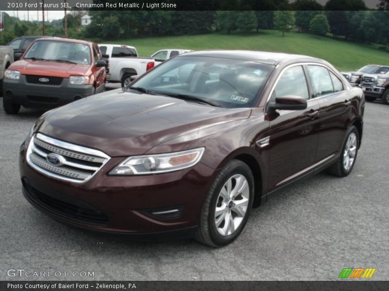 Cinnamon Red Metallic / Light Stone 2010 Ford Taurus SEL
