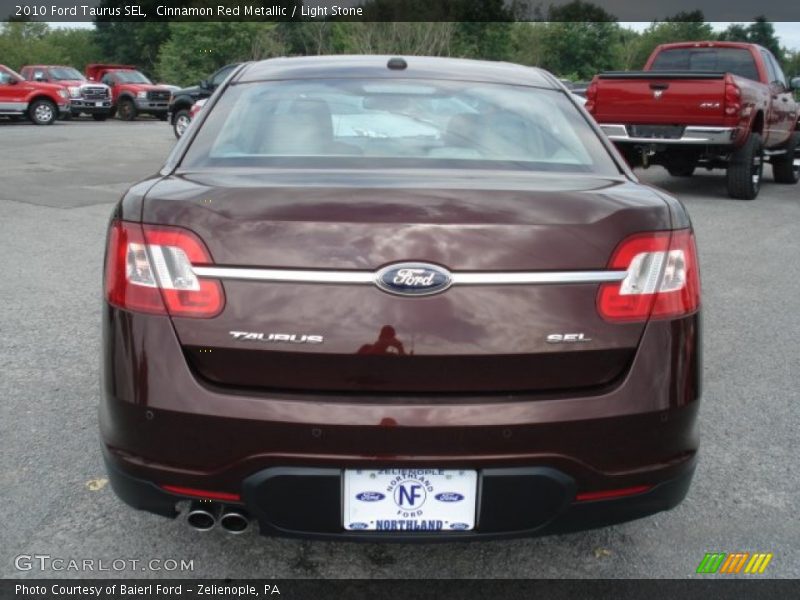 Cinnamon Red Metallic / Light Stone 2010 Ford Taurus SEL