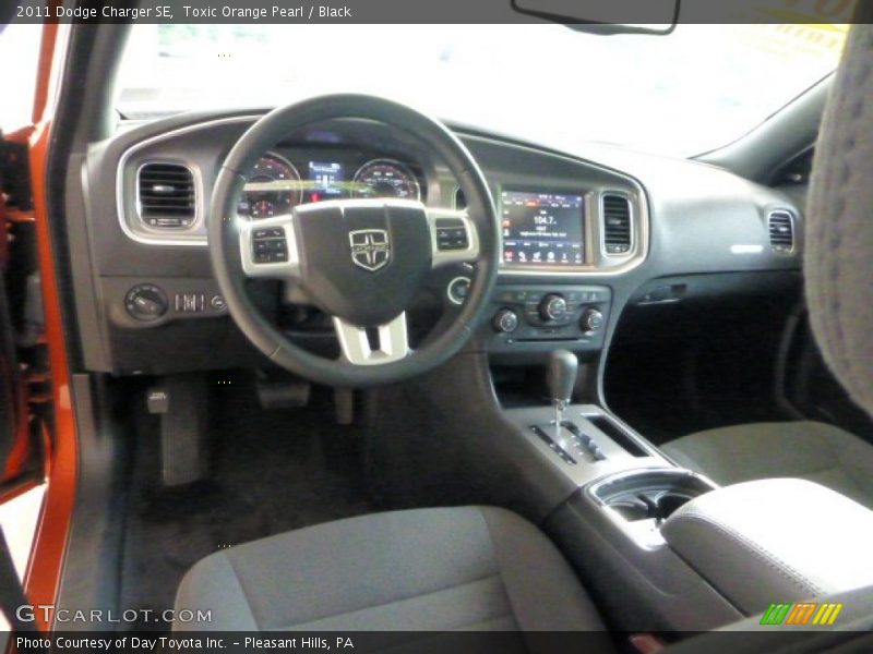 Toxic Orange Pearl / Black 2011 Dodge Charger SE