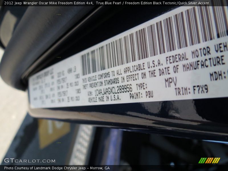 True Blue Pearl / Freedom Edition Black Tectonic/Quick Silver Accent 2012 Jeep Wrangler Oscar Mike Freedom Edition 4x4