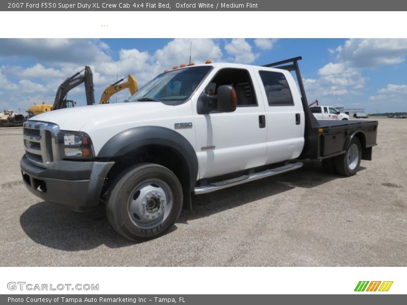 Front 3/4 View of 2007 F550 Super Duty XL Crew Cab 4x4 Flat Bed