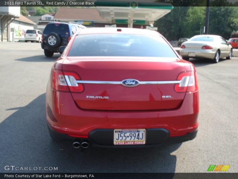 Red Candy / Charcoal Black 2011 Ford Taurus SEL