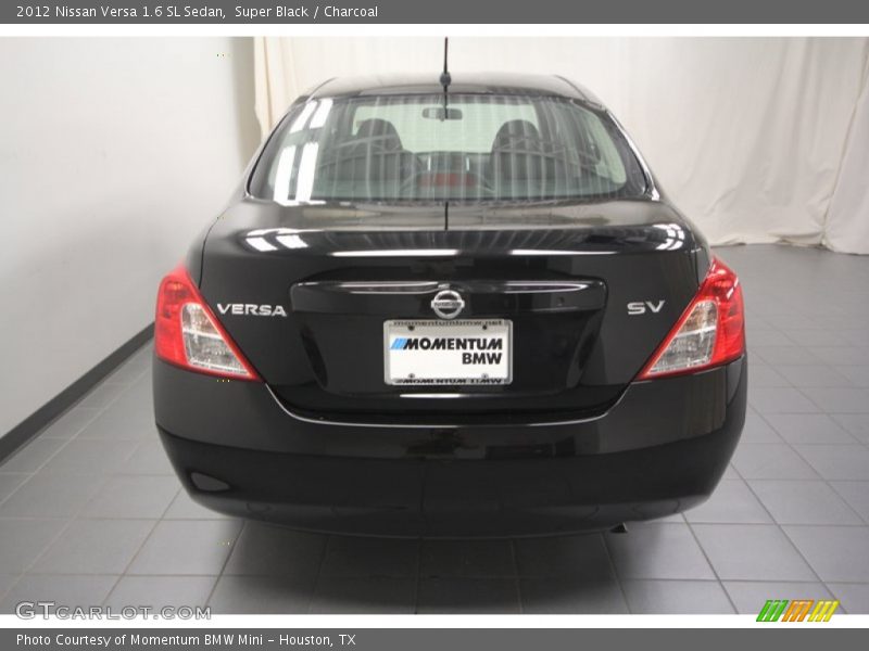 Super Black / Charcoal 2012 Nissan Versa 1.6 SL Sedan