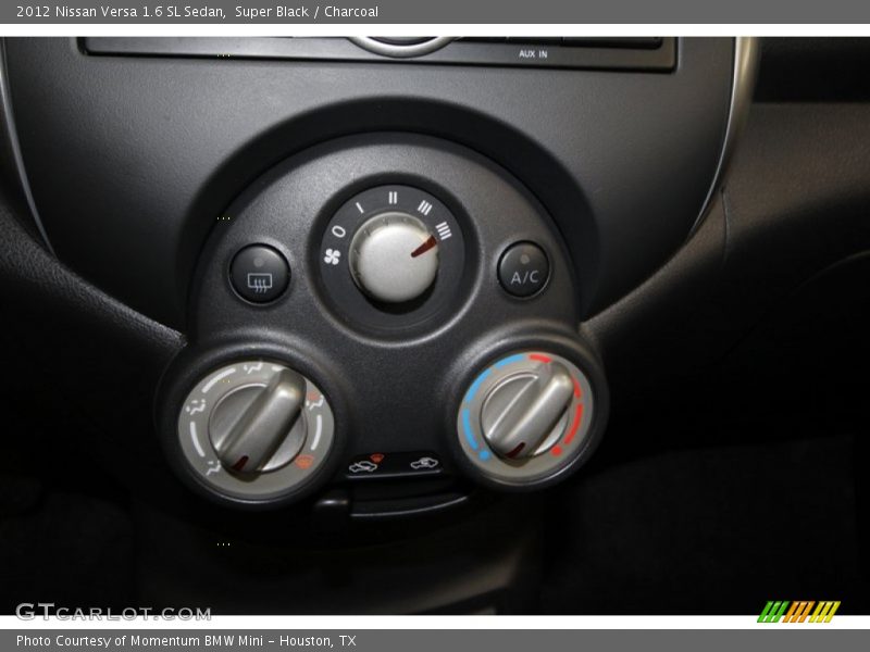 Super Black / Charcoal 2012 Nissan Versa 1.6 SL Sedan