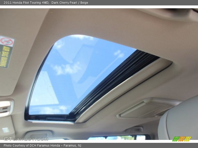 Dark Cherry Pearl / Beige 2011 Honda Pilot Touring 4WD