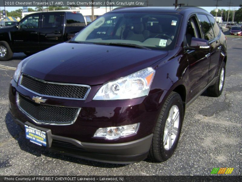 Dark Cherry Metallic / Dark Gray/Light Gray 2010 Chevrolet Traverse LT AWD